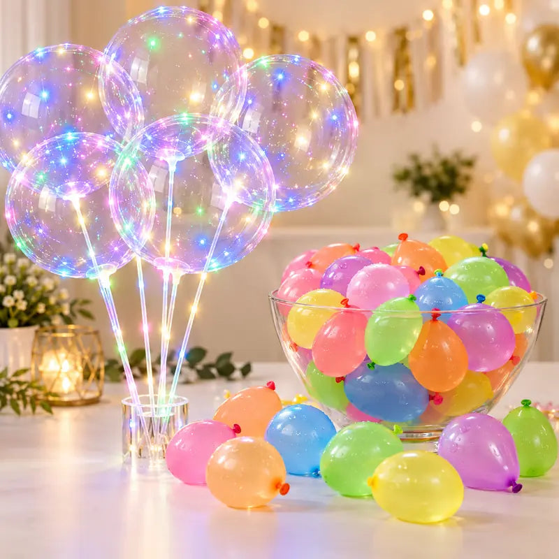 Glowing transparent LED balloons displayed beside small colorful water balloons