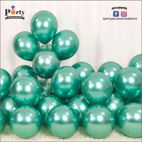 green shiny balloons for dino birthday setup 