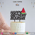 One in a melon theme cake topper on wood