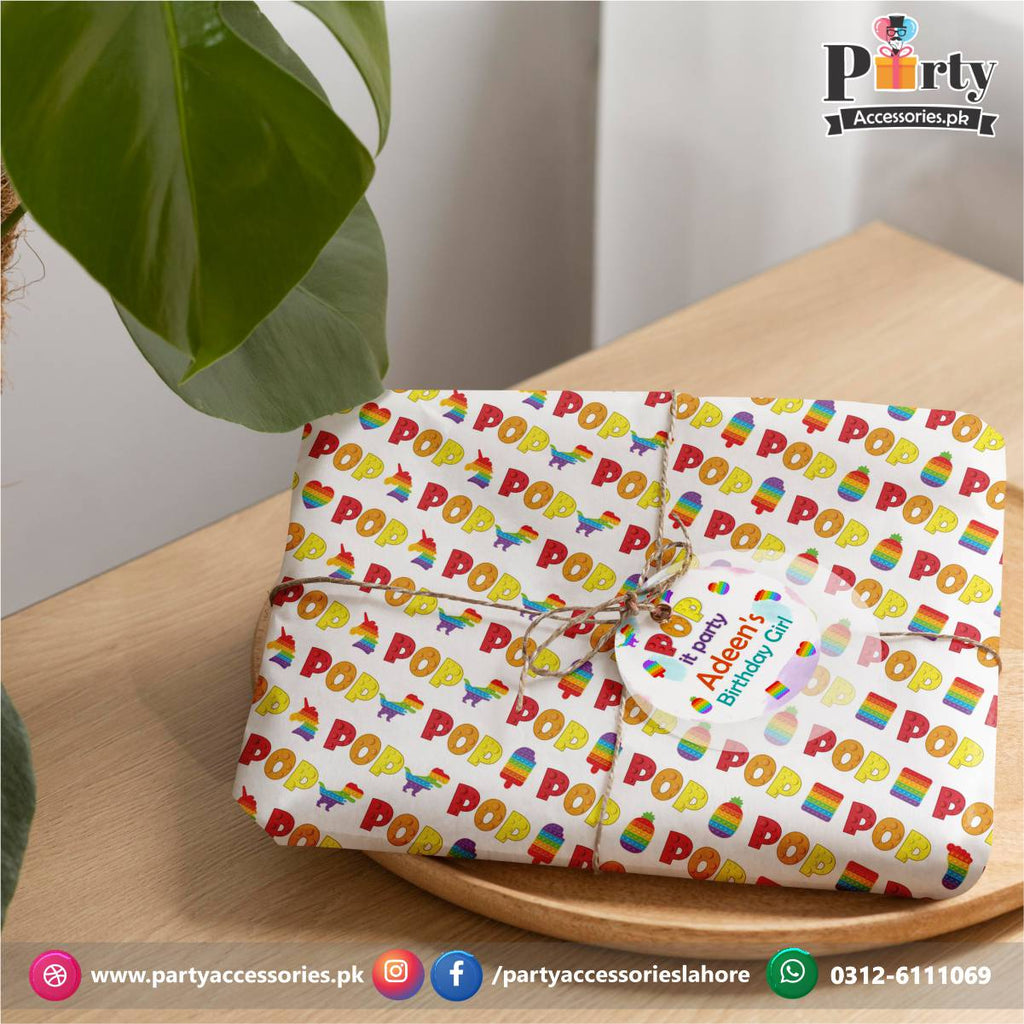 Gift Wrapping Sheet With a Tag And Jute Ribbon In Pop It Party Theme Party